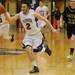 Pioneer senior Nick Bertoia runs the ball down the court  during the second half against Dexter during a district match up at Pioneer on Wednesday. Melanie Maxwell I AnnArbor.com